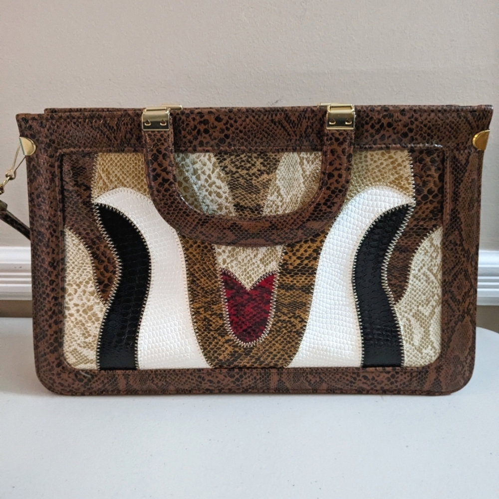Vintage skinned "briefcase" bag.  Strap and handles. Zipper to close.